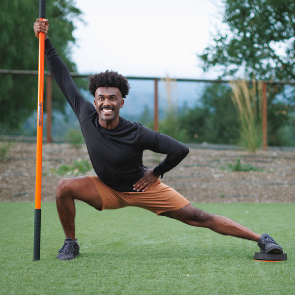 Man exercising with Stick Mobility training stick